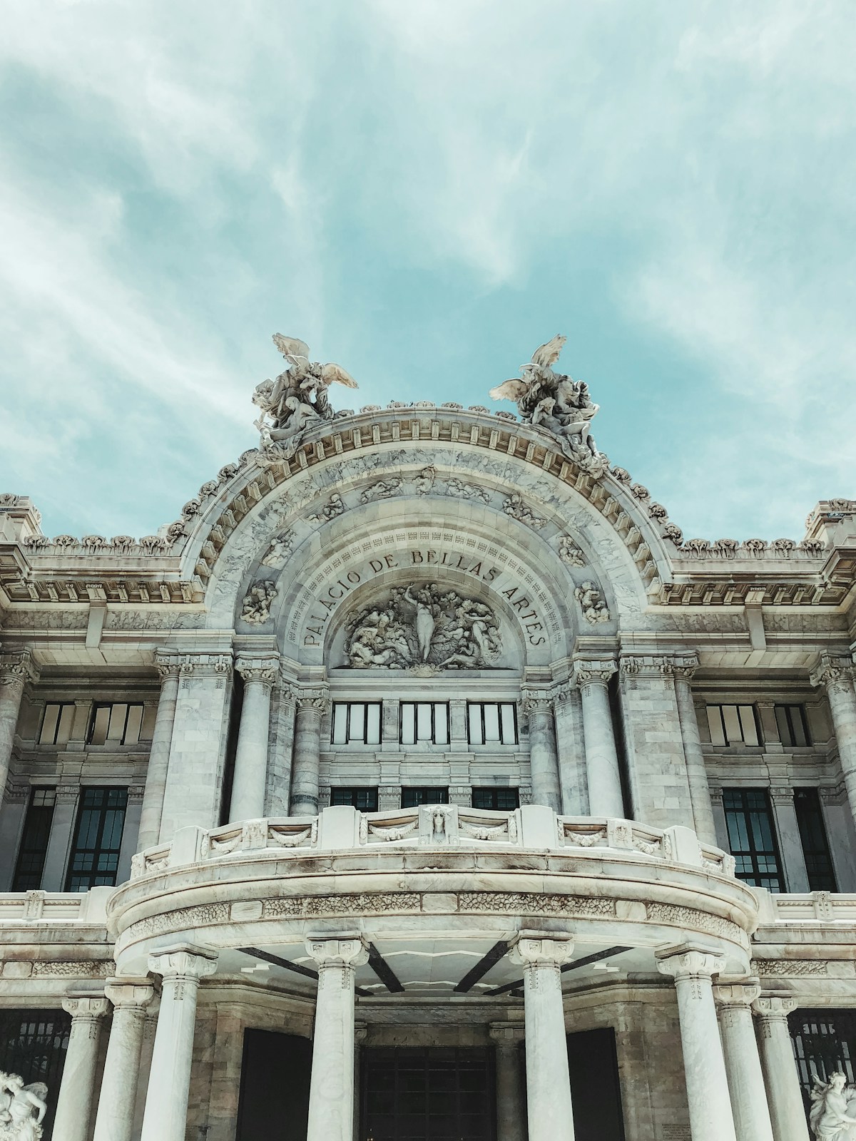 Palacio de Bellas Artes facade detail, Mexico City — white marble neoclassical facade with sculpted figures