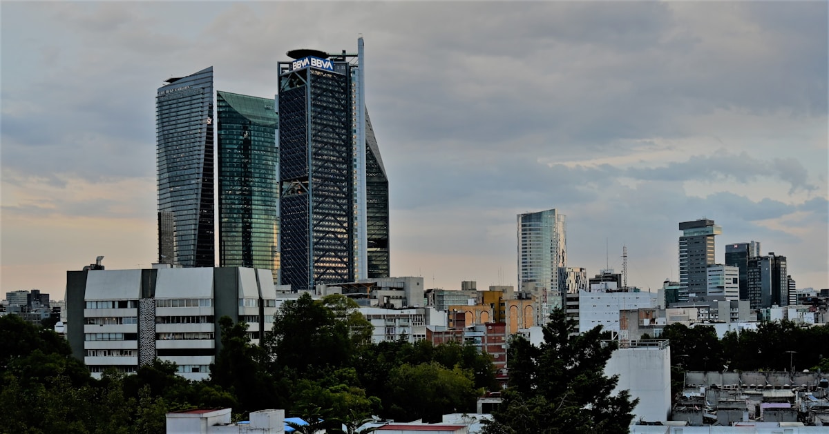 Mexico City skyline showing the Reforma corridor skyscrapers with tree-lined streets below