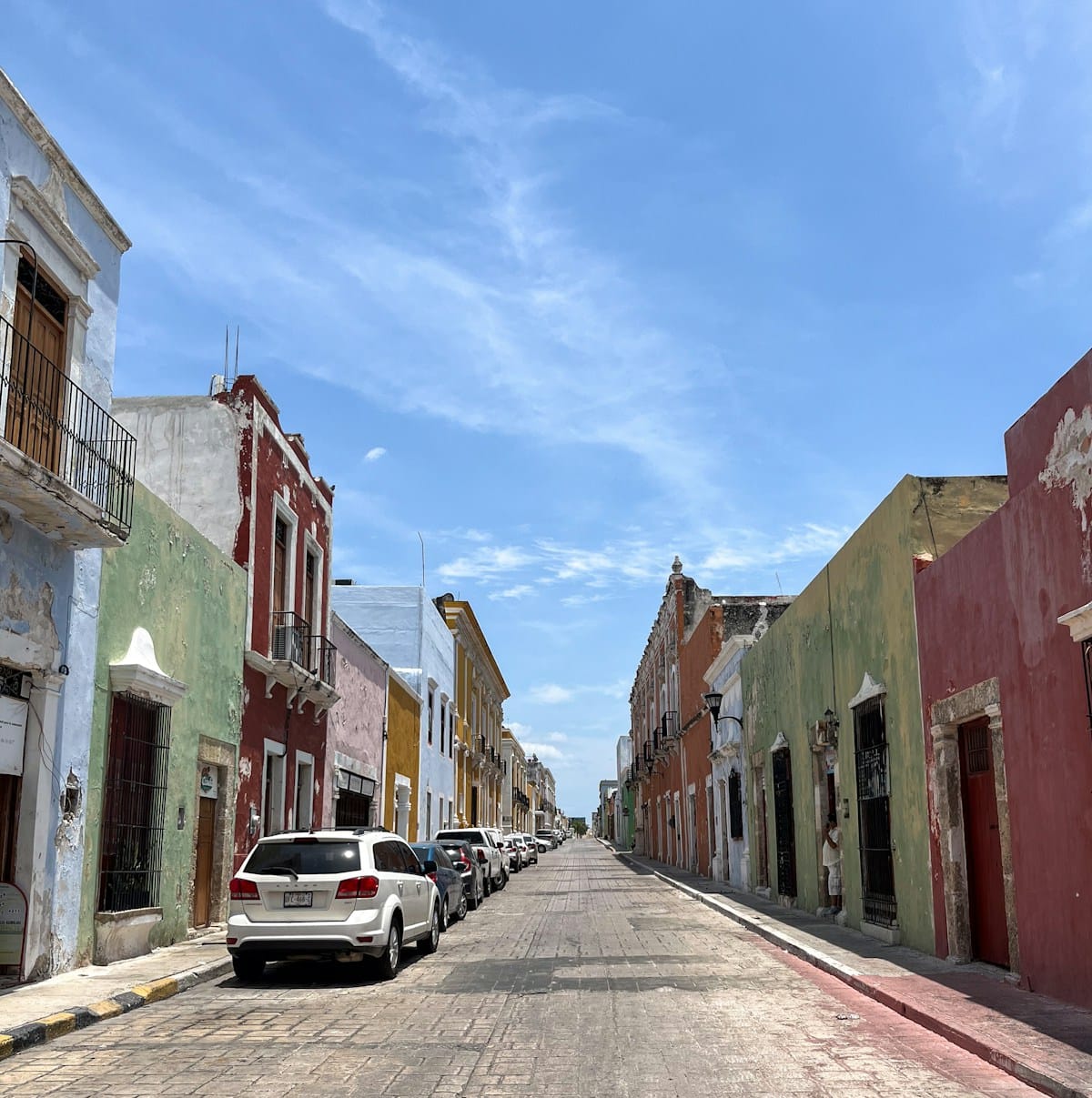 Colorful colonial street in Campeche city under a blue sky
