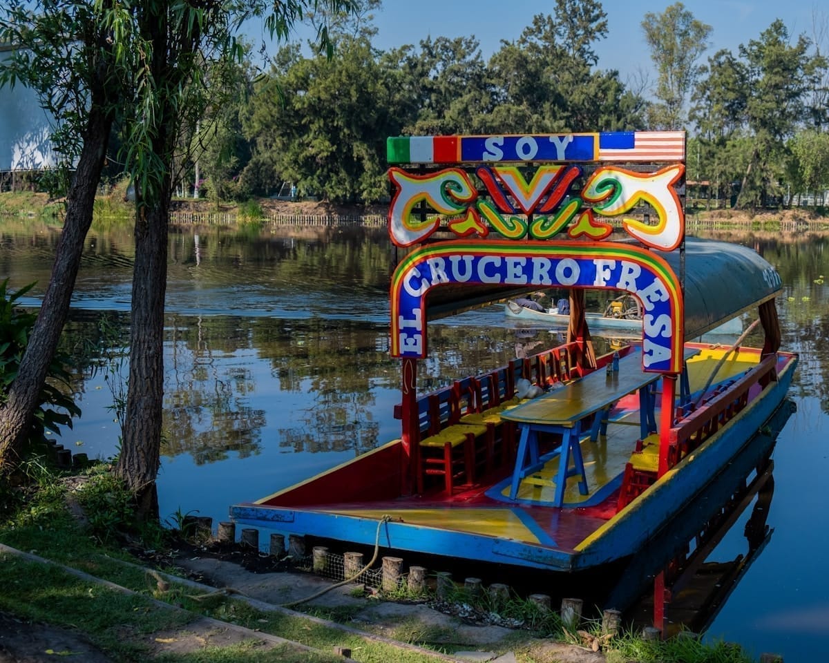 Colourful trajineras boats on Xochimilco canal, Mexico City — day trips