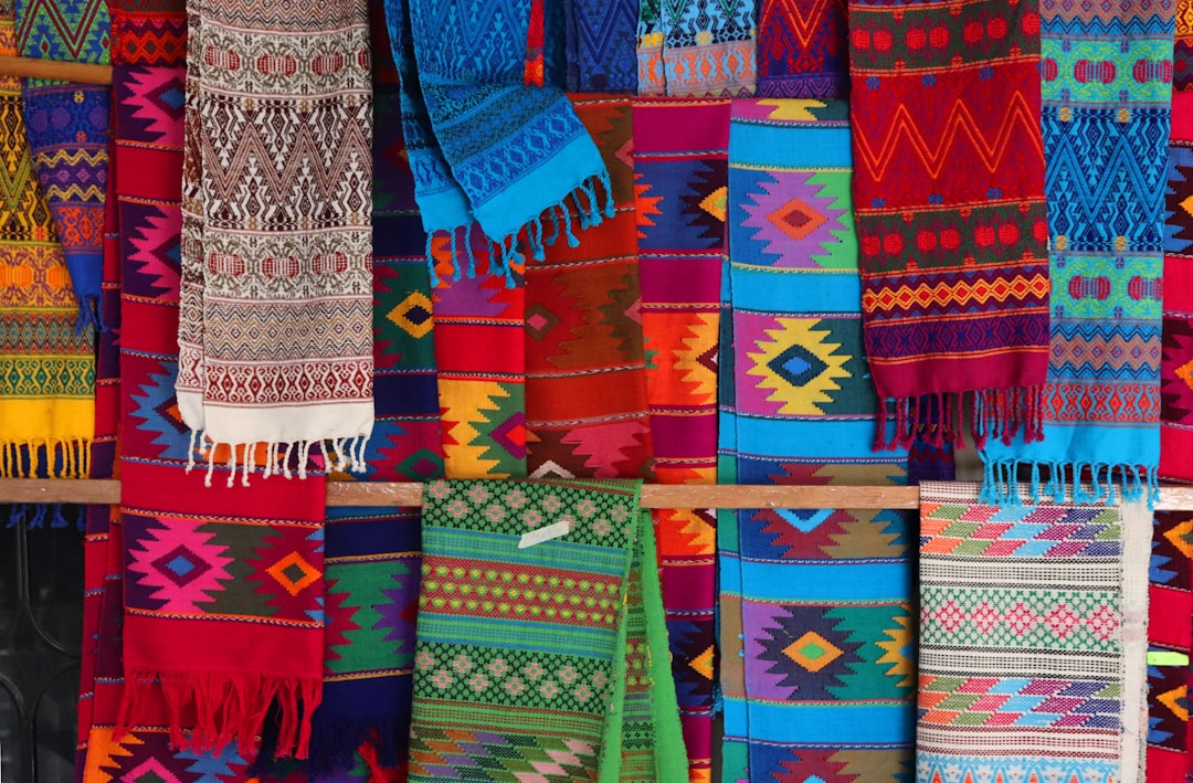 Multicolored textiles and crafts at an Oaxaca market, Mexico