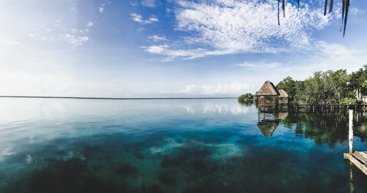 Overwater palapa cabin on the turquoise Bacalar lagoon, Quintana Roo