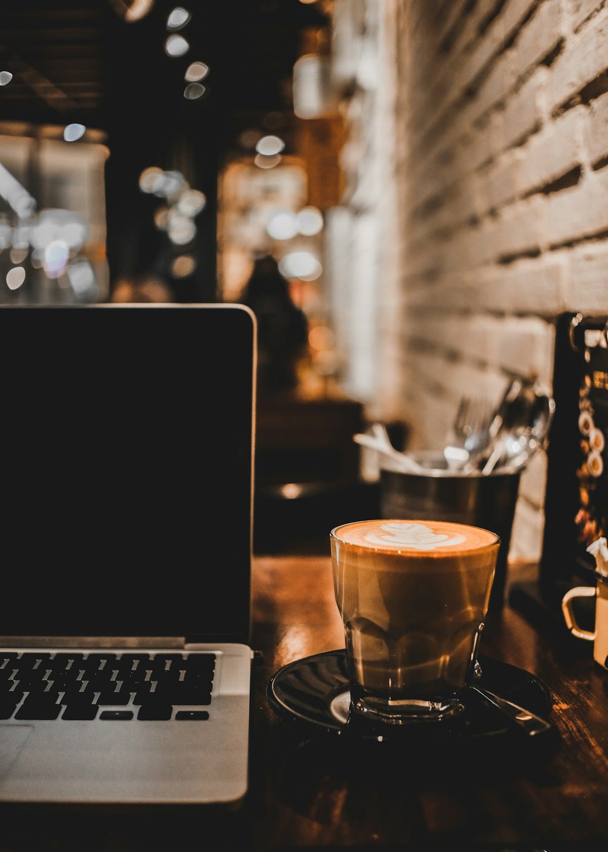 Coffee cup and laptop on table — digital nomad in Oaxaca, Mexico