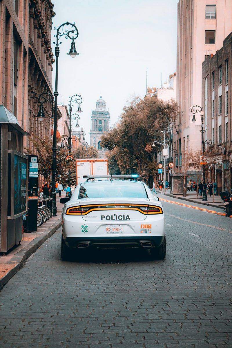 Mexico City police patrol car marked 911 on a cobblestone street near the Zocalo