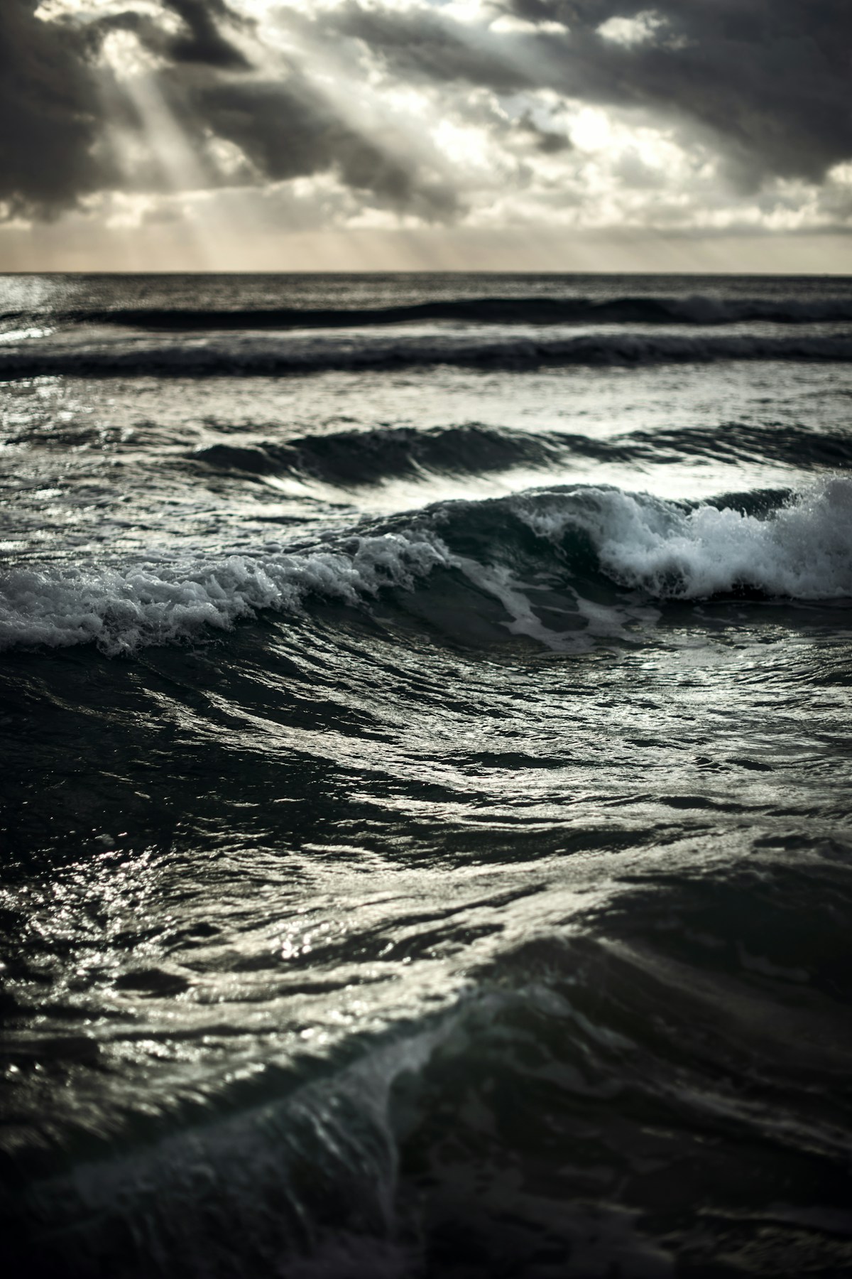 Dark storm clouds over rough ocean waves on Mexico's Caribbean coast
