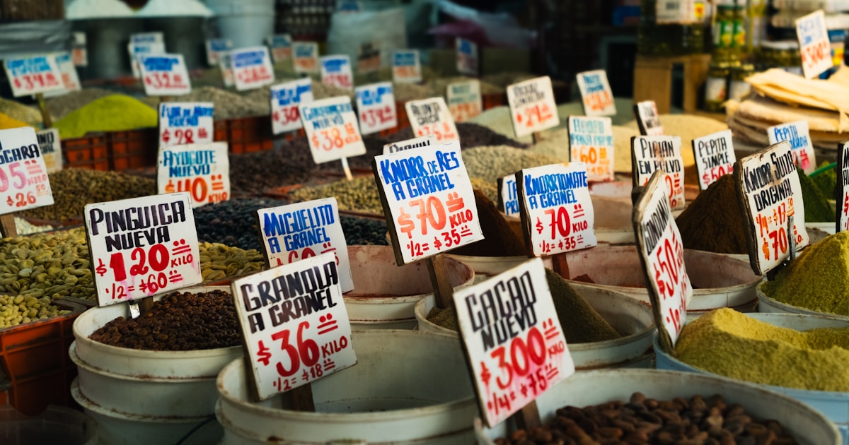 Colourful Mexican market stall with handwritten Spanish price signs