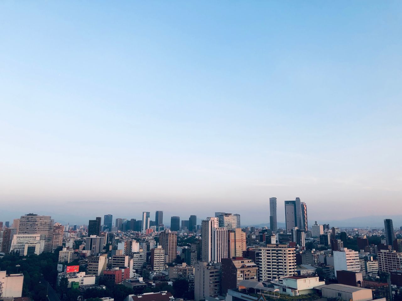 Mexico City skyline of office towers under a clear morning sky