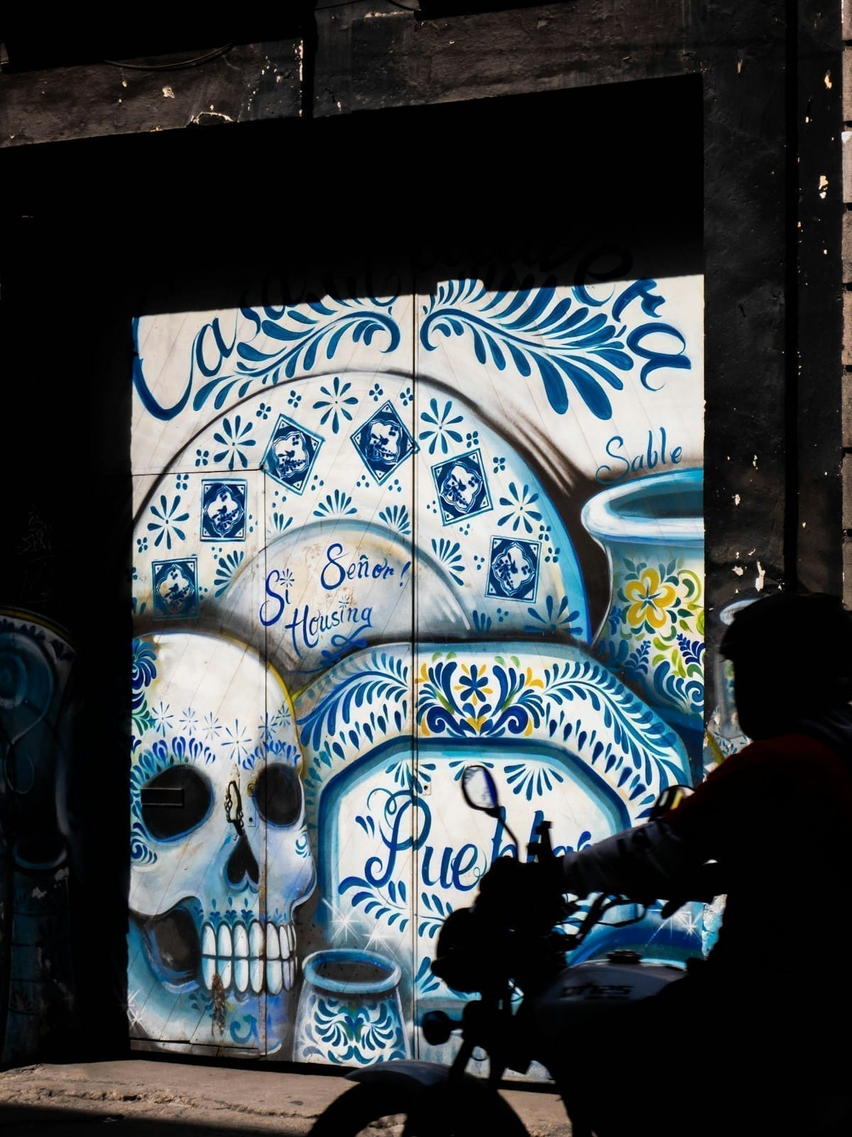 Man with colourful tiles in Heroica Puebla, Mexico