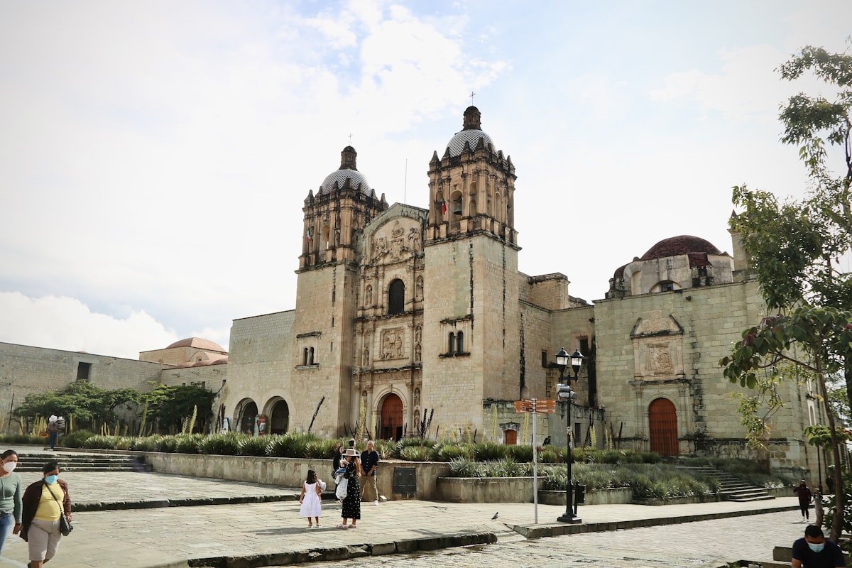 People in front of Santo Domingo de Guzmán church, Oaxaca city, Mexico