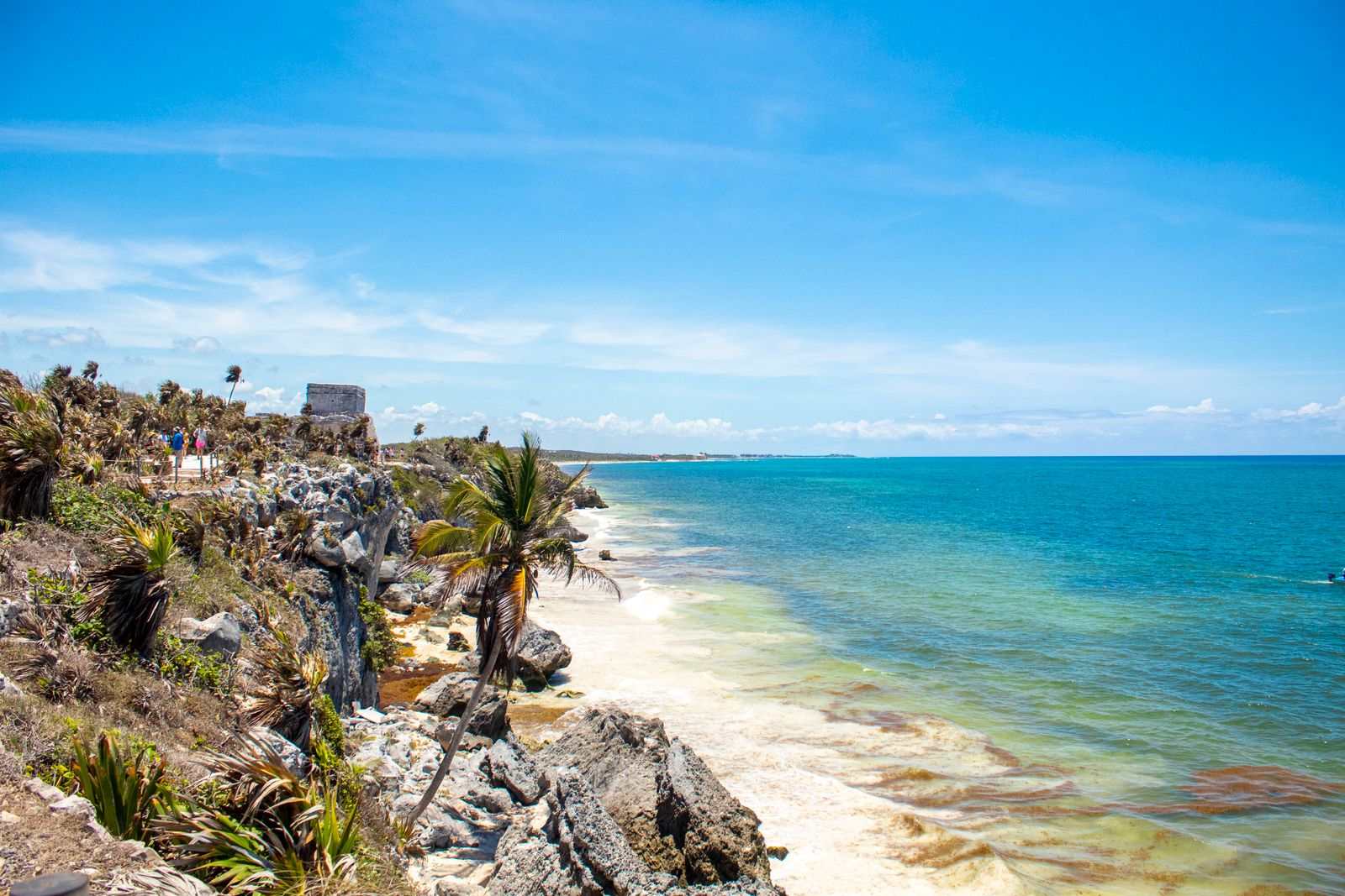 Turquoise sea and rocky beach below Tulum ruins, Mexico