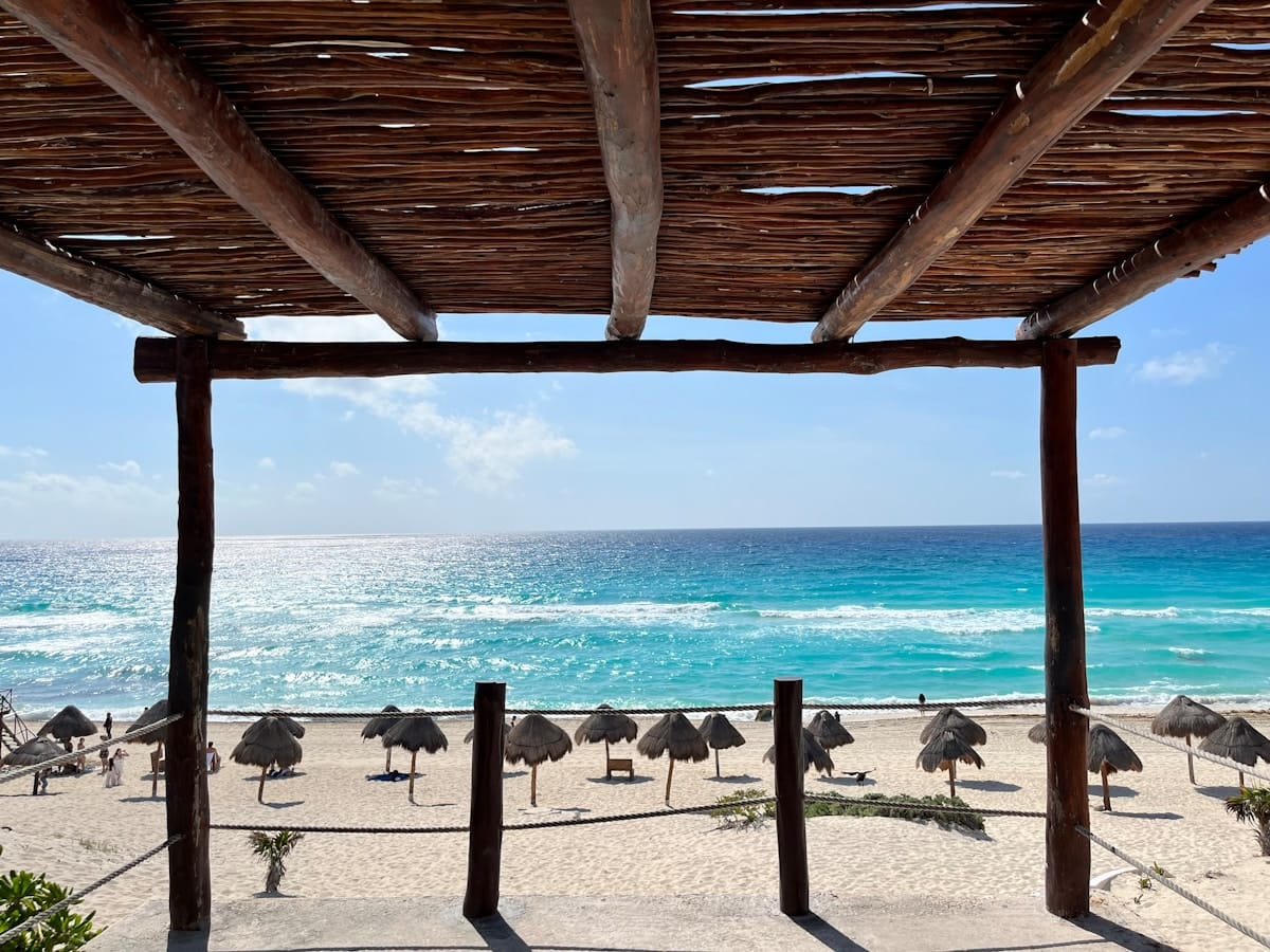 Cancún beach with umbrellas and turquoise Caribbean water, Mexico