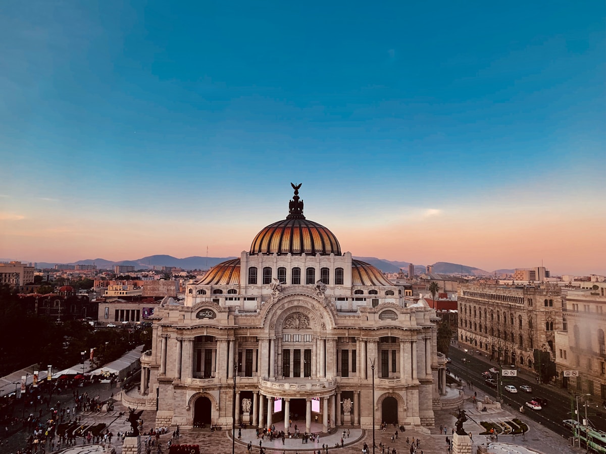Aerial photo of Palacio de Bellas Artes dome under blue sky, Mexico City, CDMX
