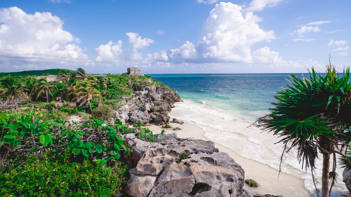 Tulum ruins castle above rocky cliffs and Caribbean beach, Quintana Roo, Mexico