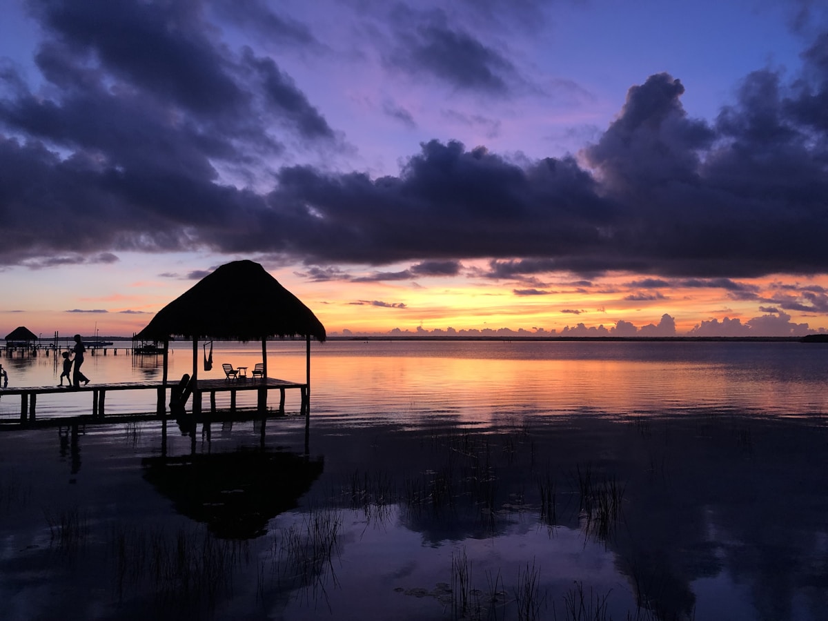 Palapa dock on Bacalar lagoon at sunset, Quintana Roo, Mexico