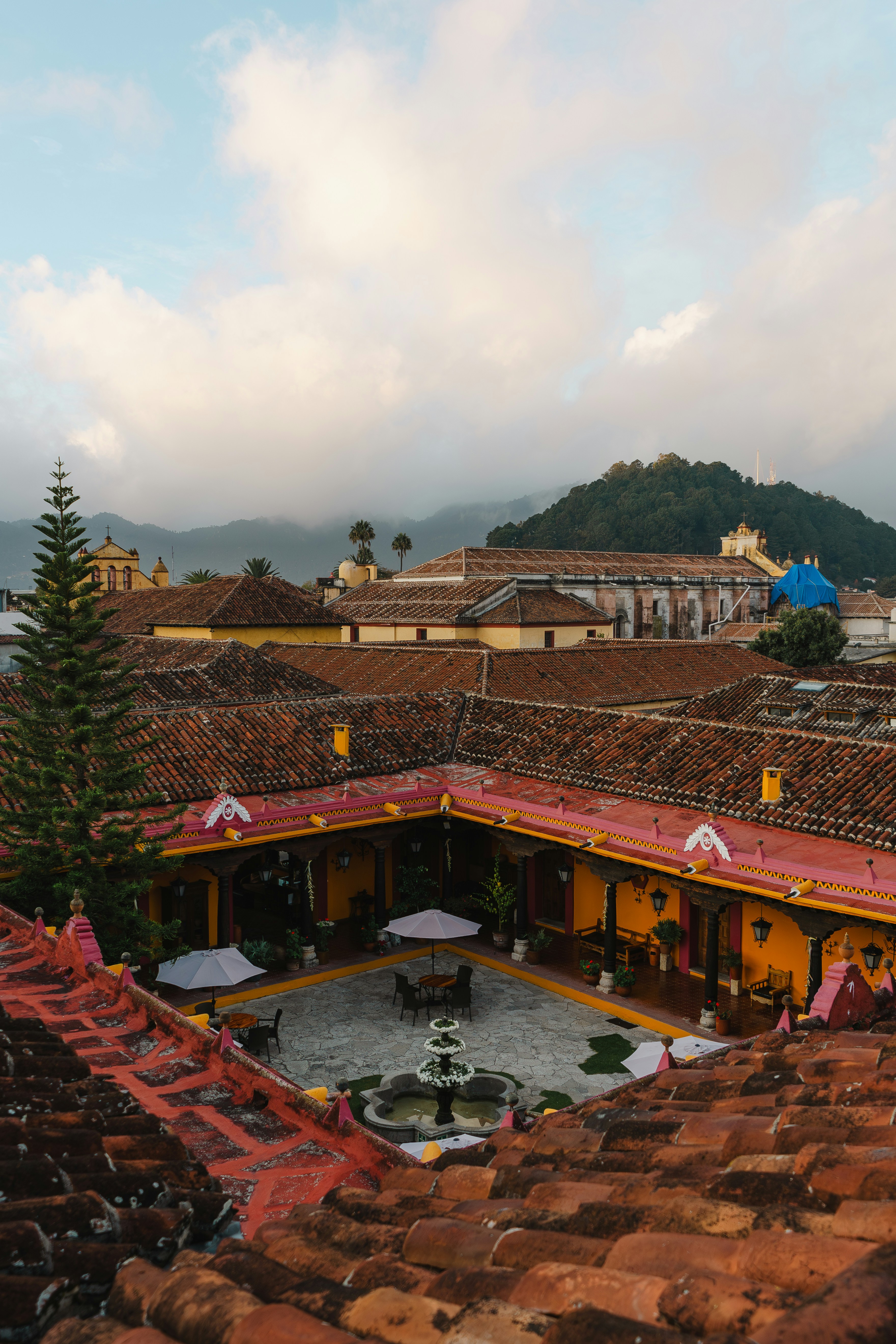 Colonial hotel courtyard with fountain and mountain views in San Cristóbal de las Casas, Chiapas