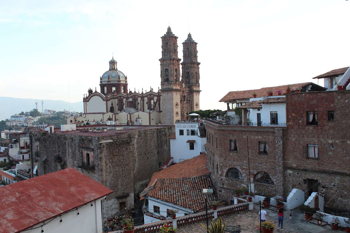 View of Taxco rooftops and Santa Prisca church towers from a hillside lookout, Guerrero, Mexico